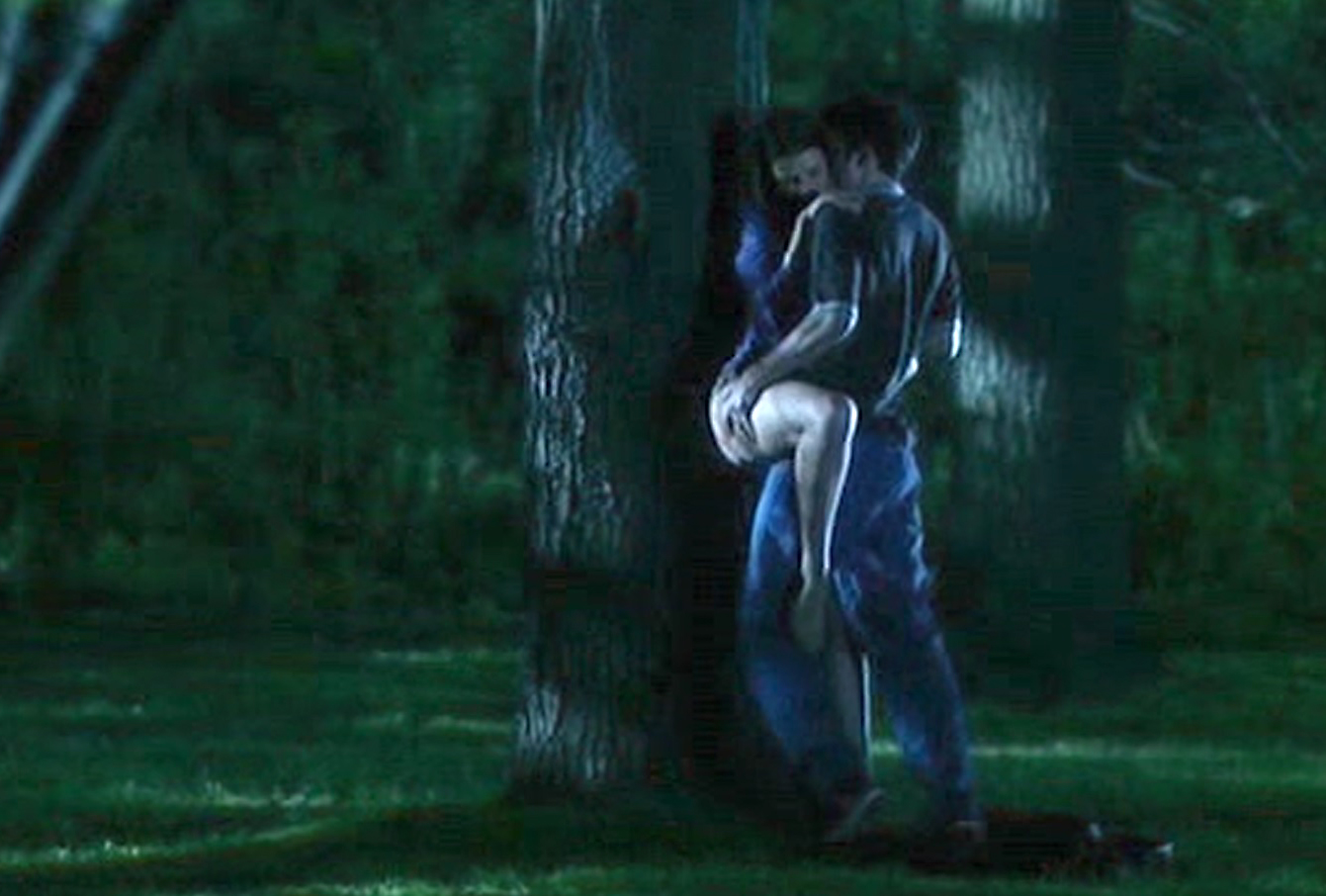 Lost and delirious sex scene against tree